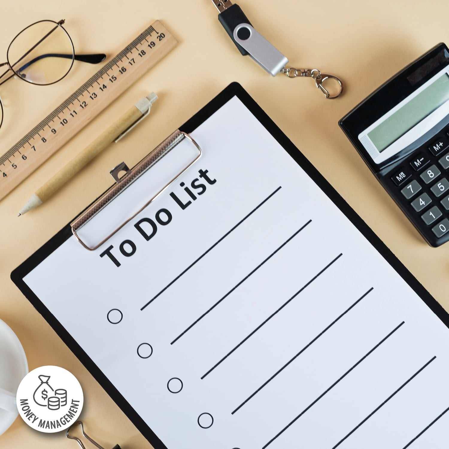 A blank to-do list on a clipboard sits on a desktop surrounded by a pen and calculator.