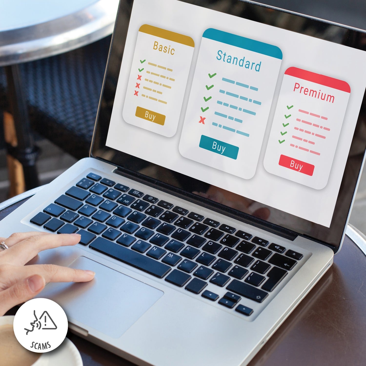 A hand navigates a laptop using a touchpad, choosing between basic, standard and premium options on the screen.